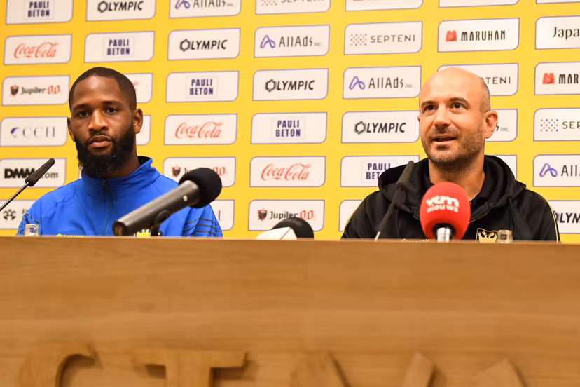 STVV's Abdoulaye Sissako and STVV's head coach Frederic De Meyer pictured during a press conference of Belgian soccer team Sint-Truidense V.V., Wednesday 19 August 2026 in Sint-Truiden, in preparations of the first leg of the play-off round for the UEFA Europa League league phase, against Cypriot team AC Omonoia Nicosia. BELGA PHOTO JILL DELSAUX
