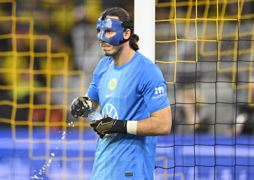 Wolfsburg's Polish goalkeeper #01 Kamil Grabara looks on during the German first division Bundesliga football match between Borussia Dortmund and VfL Wolfsburg in Dortmund on September 21, 2025. INA FASSBENDER / AFP