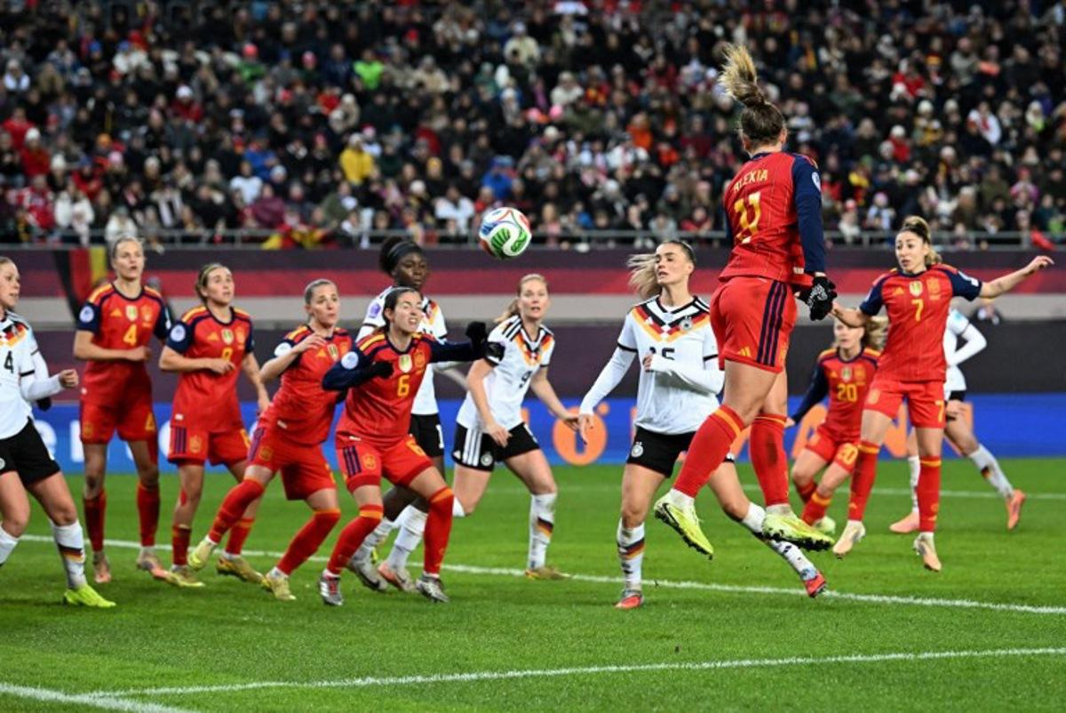 Spain's midfielder #11 Alexia Putellas heads the ball during UEFA Women's Nations League first leg final football match between Germany and Spain in Kaiserslautern, western Germany on November 28, 2025. THOMAS KIENZLE / AFP