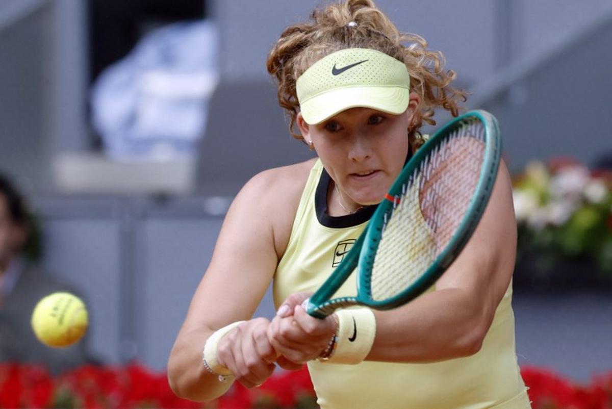Russia's Mirra Andreeva returns a ball to Ukraine's Marta Kostyuk during the 2026 WTA Tour Madrid Open tennis tournament final singles match at the Caja Magica in Madrid, on May 2, 2026. Oscar DEL POZO / AFP