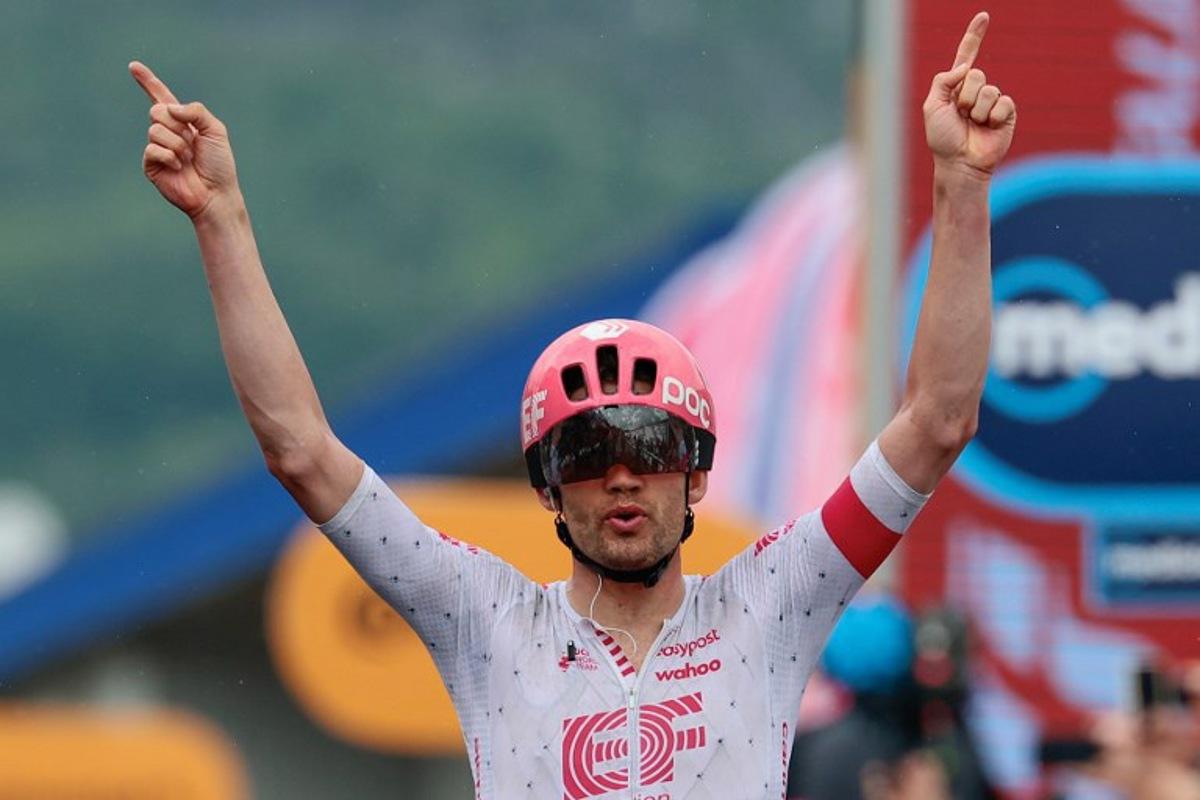 EF Education - EasyPost's Danish rider Kasper Asgreen celebrates after victory as he crosses the finish of the 14th stage of the 108th Giro d'Italia cycling race of 195kms from Treviso in Italy to Nova Gorica in Slovenia on May 24, 2025. Luca Bettini / AFP