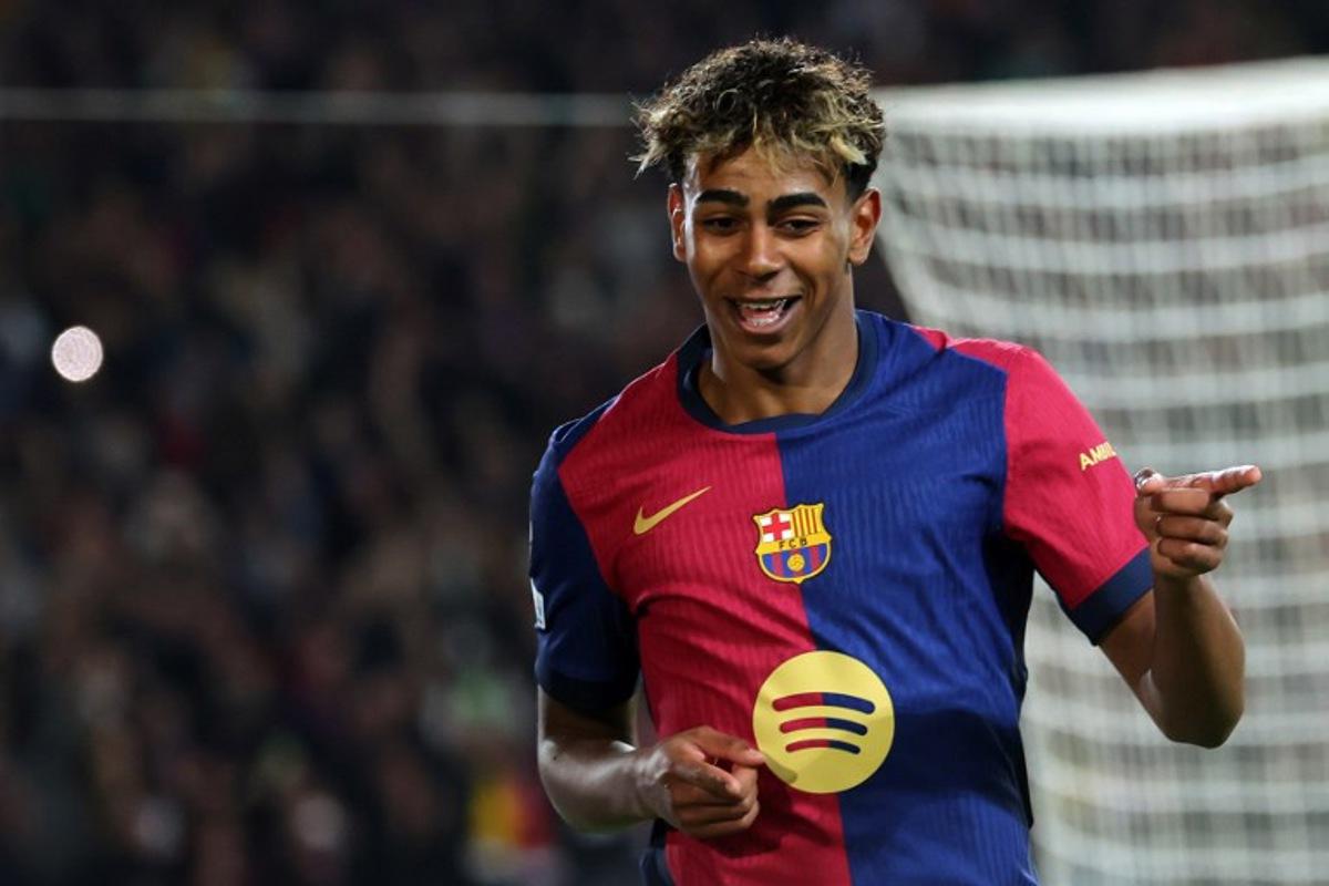 Barcelona's Spanish forward #19 Lamine Yamal celebrates scoring his team's fourth goal during the UEFA Champions League Quarter final First Leg football match between FC Barcelona and BVB Borussia Dortmund at the Estadi Olimpic Lluis Companys in Barcelona on April 9, 2025. LLUIS GENE / AFP
