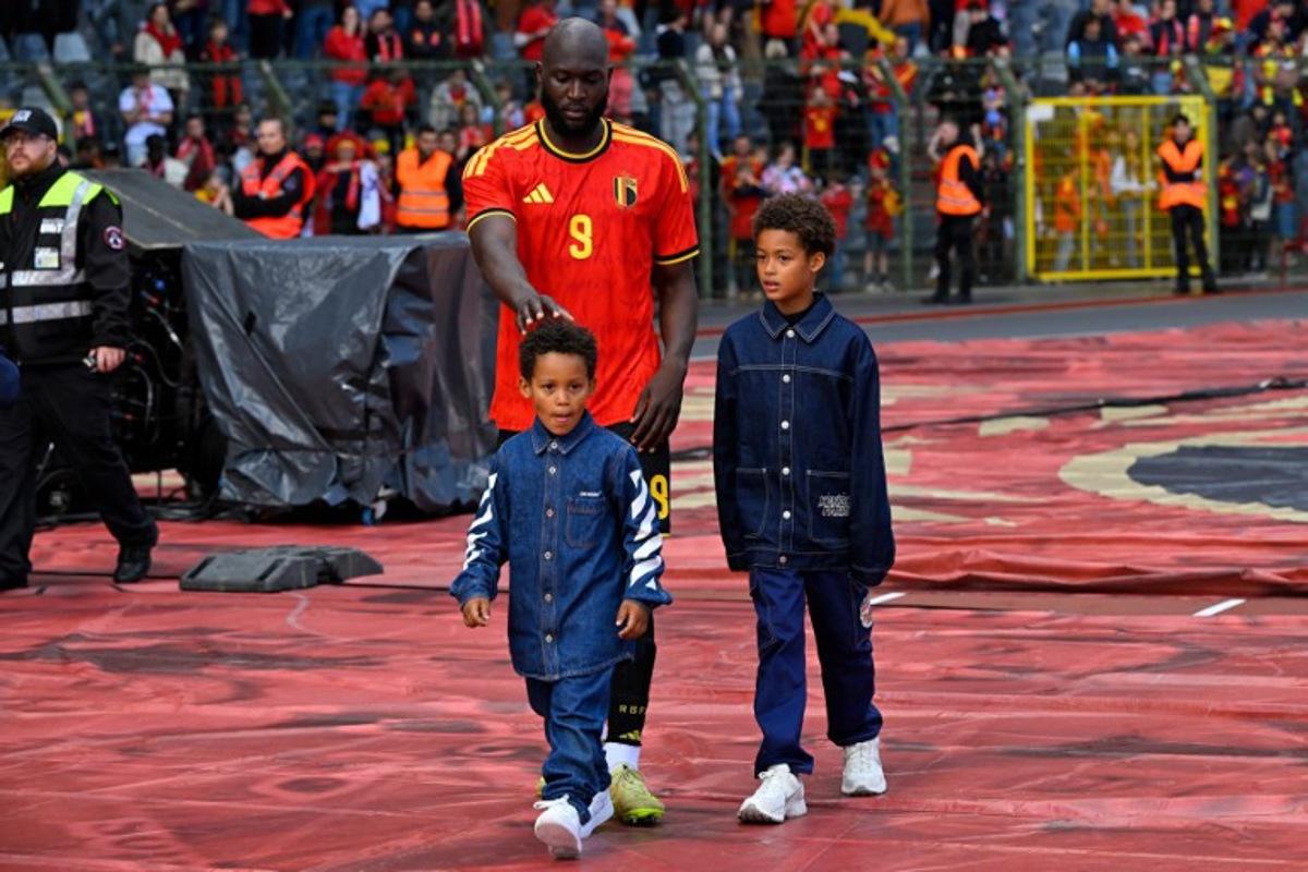 Belgium's forward #9 Romelu Lukaku walks around the stadium with his children after the international friendly football match between Belgium and Tunisia at the King Baudouin Stadium in Brussels on June 6, 2026. JOHN THYS / AFP