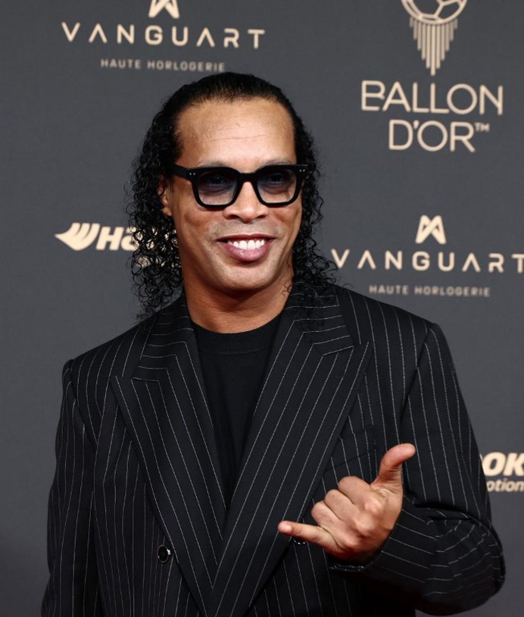 Brazilian former football player Ronaldinho poses upon arrival before the 2025 Ballon d'Or France Football award ceremony at the Theatre du Chatelet in Paris on September 22, 2025. FRANCK FIFE / AFP