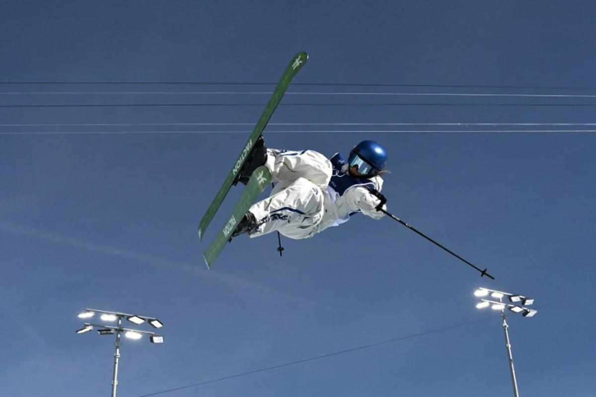 China's Gu Ailing Eileen competes in the freestyle skiing women's freeski halfpipe final run 2 during the Milano Cortina 2026 Winter Olympic Games at Livigno Snow Park, in Livigno (Valtellina), on February 22, 2026. Jeff PACHOUD / AFP