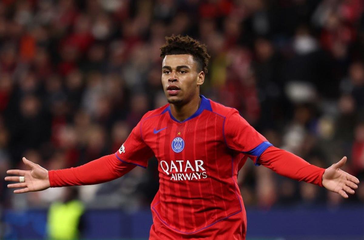 Paris Saint-Germain's French midfielder #14 Desire Doue celebrates scoring the 1-4 goal with his teammates during the UEFA Champions League football match between Bayer 04 Leverkusen and Paris Saint-Germain (PSG) at the BayArena stadium in Leverkusen, western Germany on October 21, 2025. FRANCK FIFE / AFP