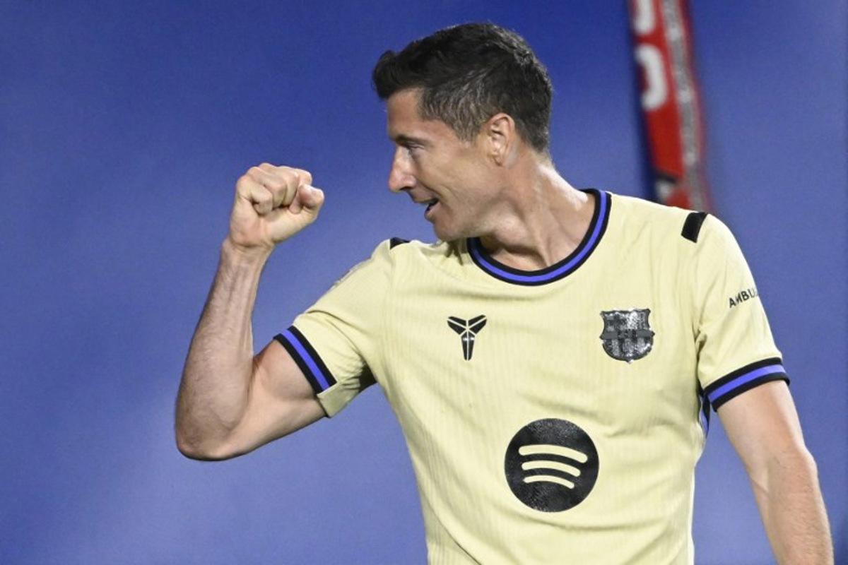 Barcelona's Polish forward #09 Robert Lewandowski celebrates scoring the opening goal during the Spanish league football match between CA Osasuna and FC Barcelona at El Sadar Stadium in Pamplona on May 2, 2026. ANDER GILLENEA / AFP