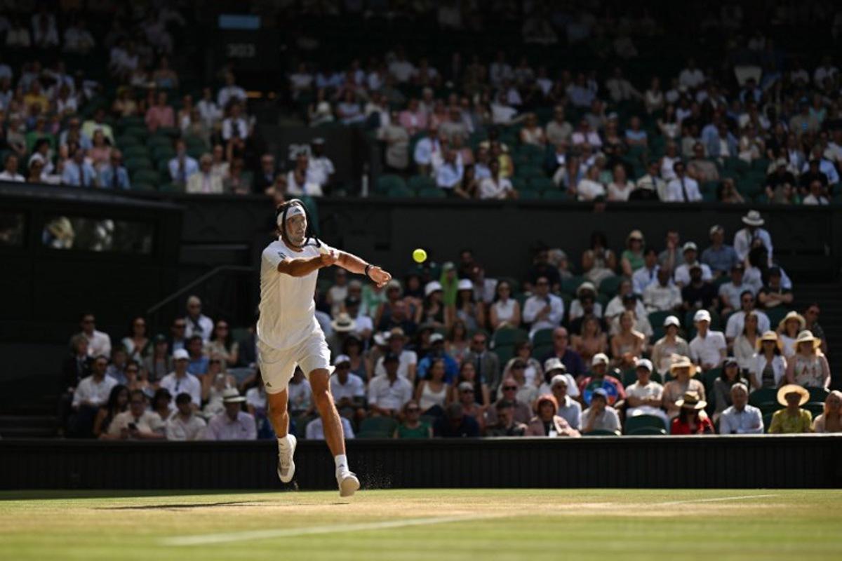 Germany's Alexander Zverev returns to Czech Republic's Jiri Lehecka during their men's singles round of 16 tennis match on the ninth day of the 2026 Wimbledon Championships at The All England Lawn Tennis and Croquet Club in Wimbledon, southwest London, on July 7, 2026. Glyn KIRK / AFP
