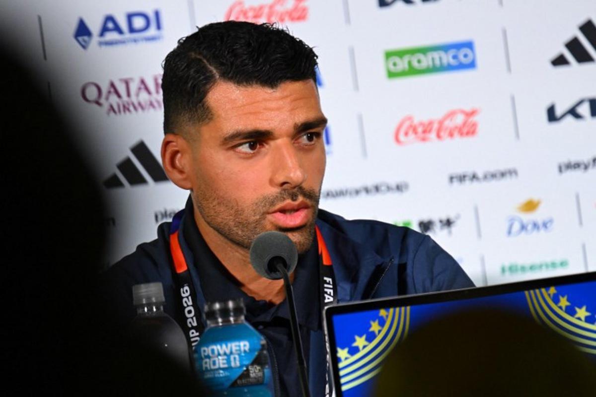 Iran's forward #09 Mehdi Taremi gives a press conference at Los Angeles Stadium in Inglewood on June 14, 2026, on the eve of the 2026 World Cup football match between Iran and New Zealand. Patrick T. FALLON / AFP