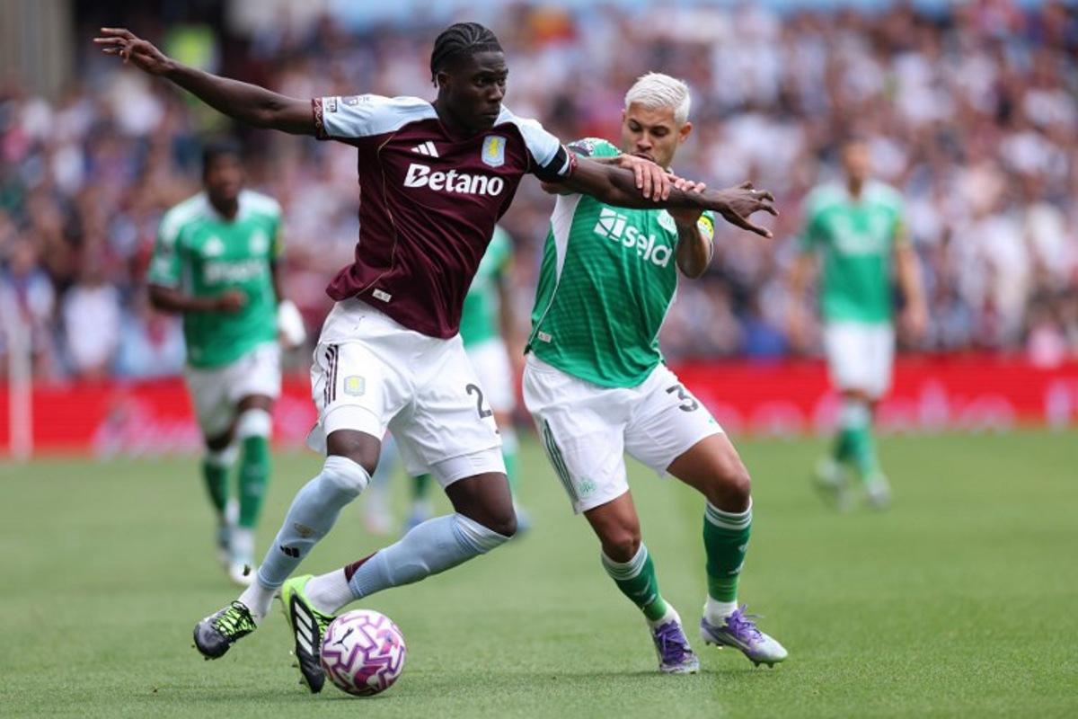 Aston Villa's Belgian defender #24 Amadou Onana (L) vies with Newcastle United's Brazilian midfielder #39 Bruno Guimaraes (R) during the English Premier League football match between Aston Villa and Newcastle United at Villa Park in Birmingham, central England on August 16, 2025. Adrian Dennis / AFP