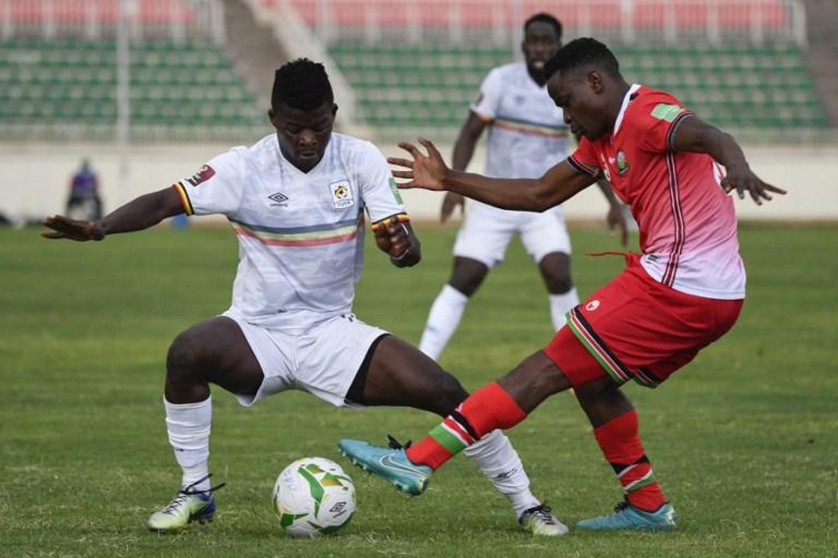 Uganda's Ibrahim Orit (L) fights for the ball with Kenya's Erick Otieno (R) during the FIFA World Cup Qatar 2022 qualifying round Group E football match between Kenya and Uganda at the Nyayo National Stadium in Nairobi on September 2, 2021. TONY KARUMBA / AFP