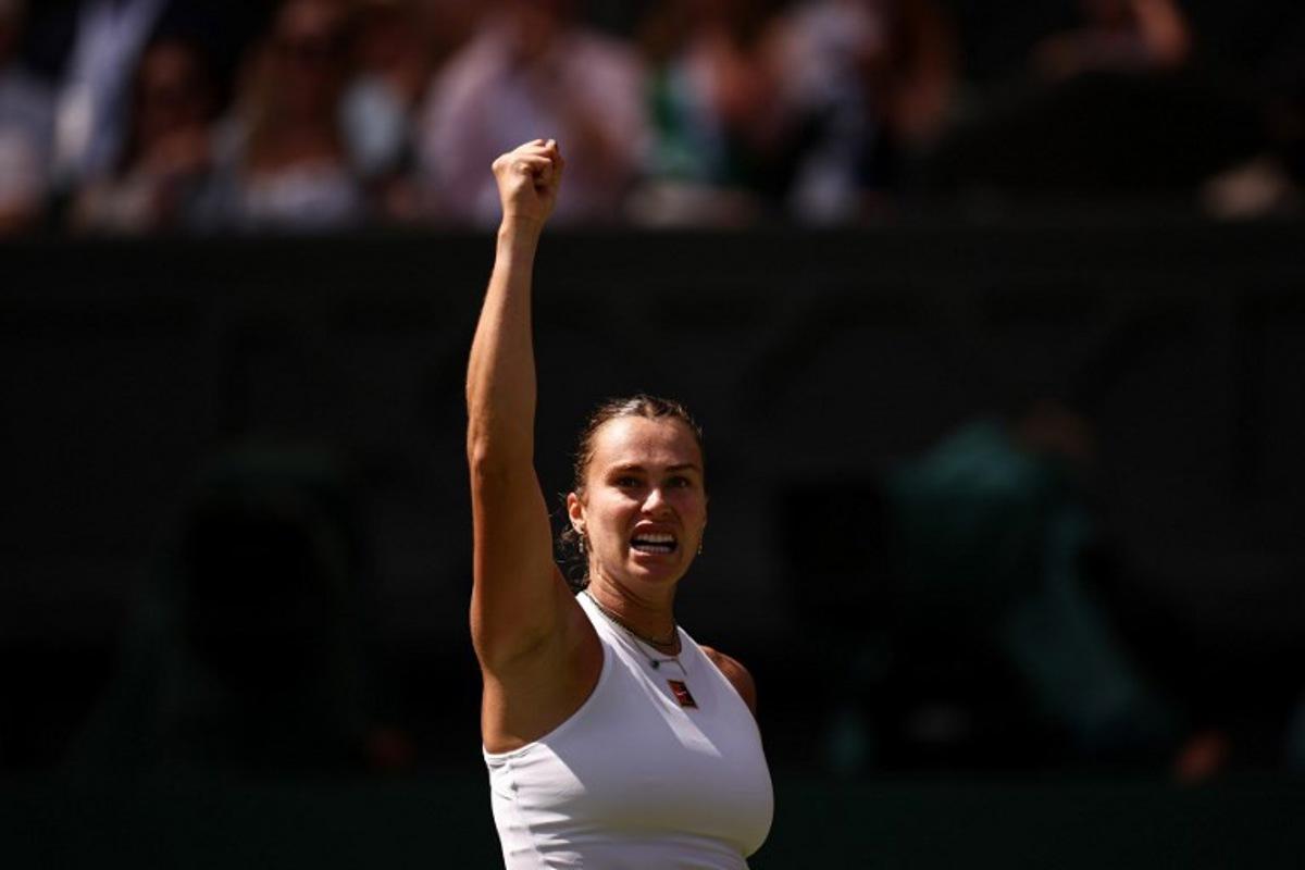Belarus's Aryna Sabalenka celebrates after winning a point against US player Amanda Anisimova during their women's singles semi-final tennis match on the eleventh day of the 2025 Wimbledon Championships at The All England Lawn Tennis and Croquet Club in Wimbledon, southwest London, on July 10, 2025. HENRY NICHOLLS / AFP