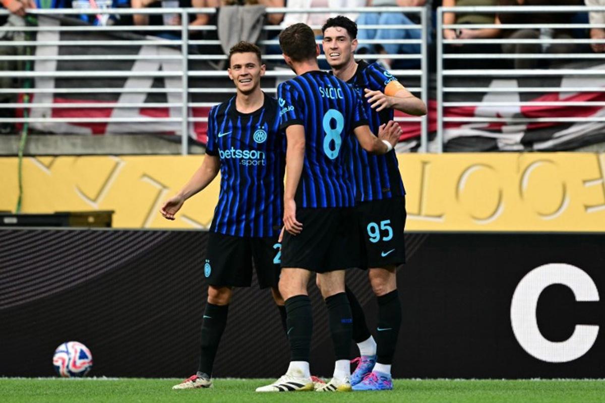 Inter Milan's Italian defender #95 Alessandro Bastoni (R) celebrates with teammates Albanian midfielder #21 Kristjan Asllani (L) and Bosnian midfielder #08 Petar Sucic after scoring his team's second goal during the FIFA Club World Cup 2025 Group E football match between Italy's Inter Milan and Argentina's River Plate at the Lumen Field stadium in Seattle on June 23, 2025. Pablo PORCIUNCULA / AFP