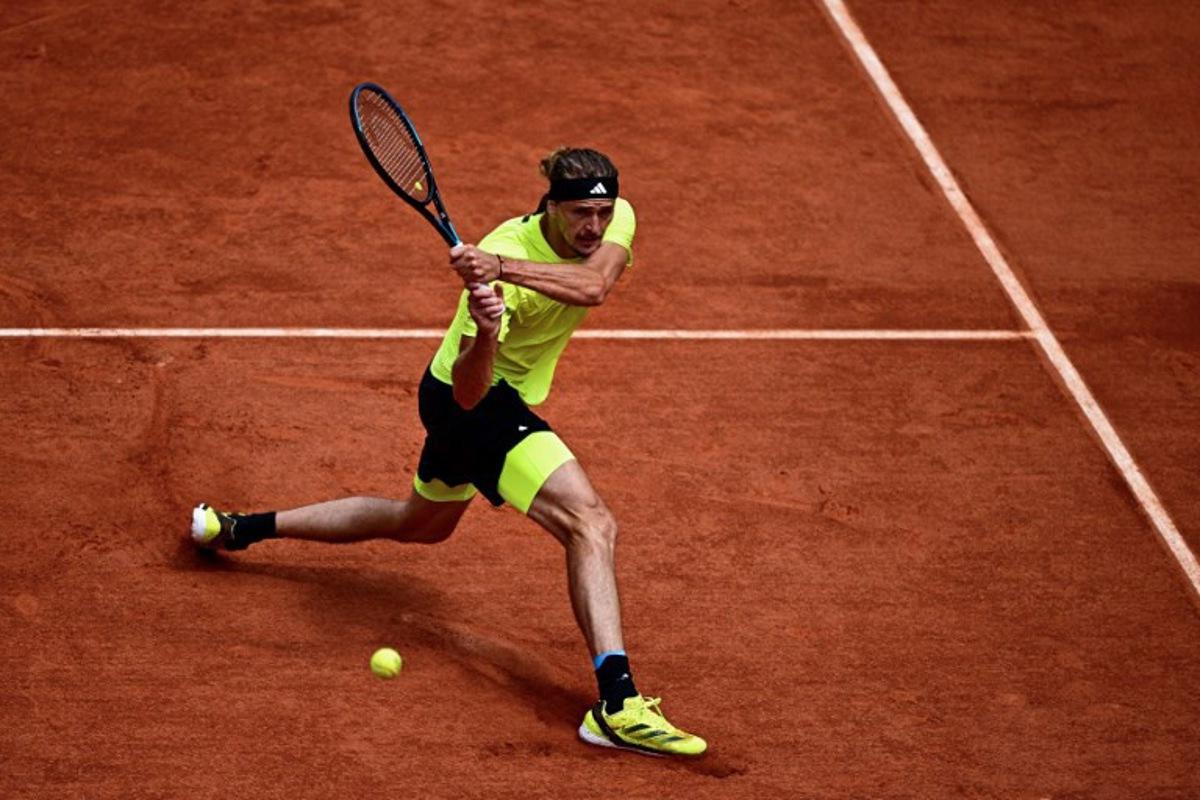 Germany's Alexander Zverev plays a backhand return to Netherlands' Tallon Griekspoor during their men's singles match on day 9 of the French Open tennis tournament on Court Suzanne-Lenglen at the Roland-Garros Complex in Paris on June 2, 2025. JULIEN DE ROSA / AFP