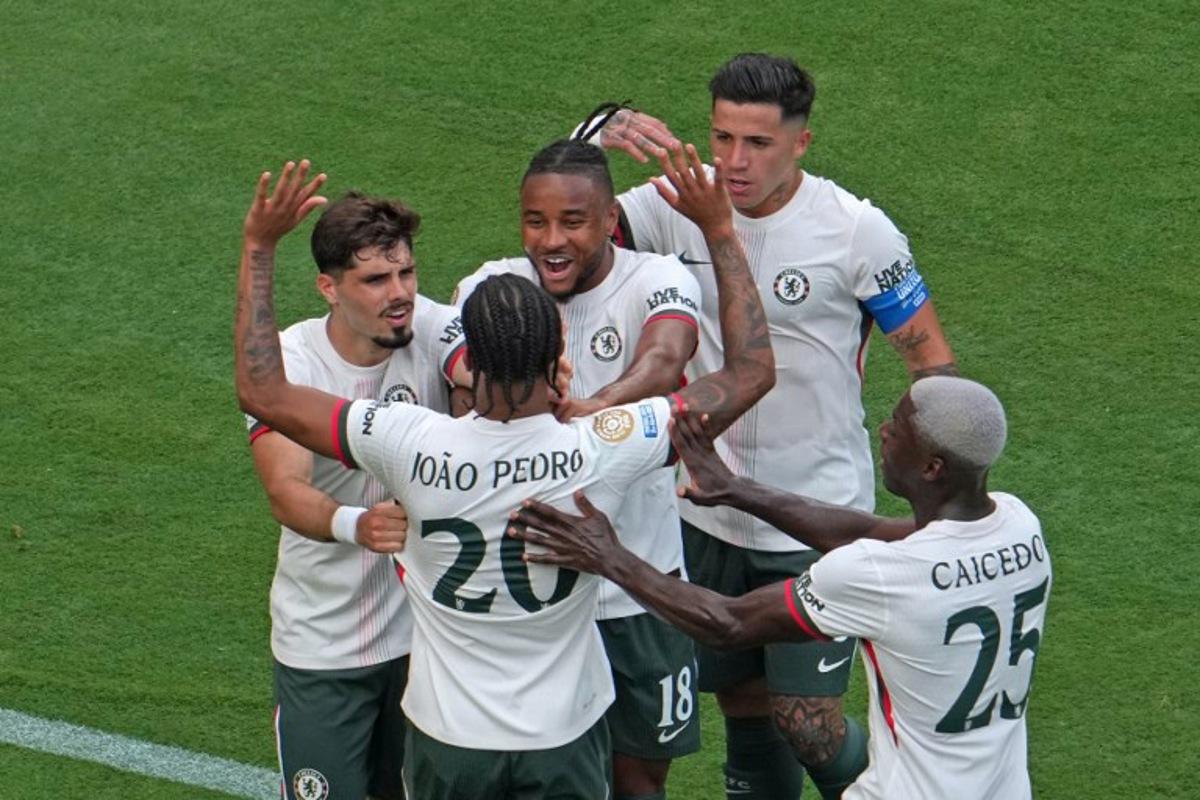 Chelsea's Brazilian forward #20 Joao Pedro celebrates with his teammates Chelsea's Argentinian midfielder #08 Enzo Fernandez (2-R), Chelsea's French striker #18 Christopher Nkunku, Chelsea's Portuguese midfielder #07 Pedro Neto (L), and Chelsea's Ecuadorian midfielder #25 Moises Caicedo after scoring his team's first goal during the FIFA Club World Cup 2025 semifinal football match between Brazil's Fluminense and England's Chelsea at the MetLife stadium in East Rutherford, New Jersey on July 8, 2025. TIMOTHY A. CLARY / AFP