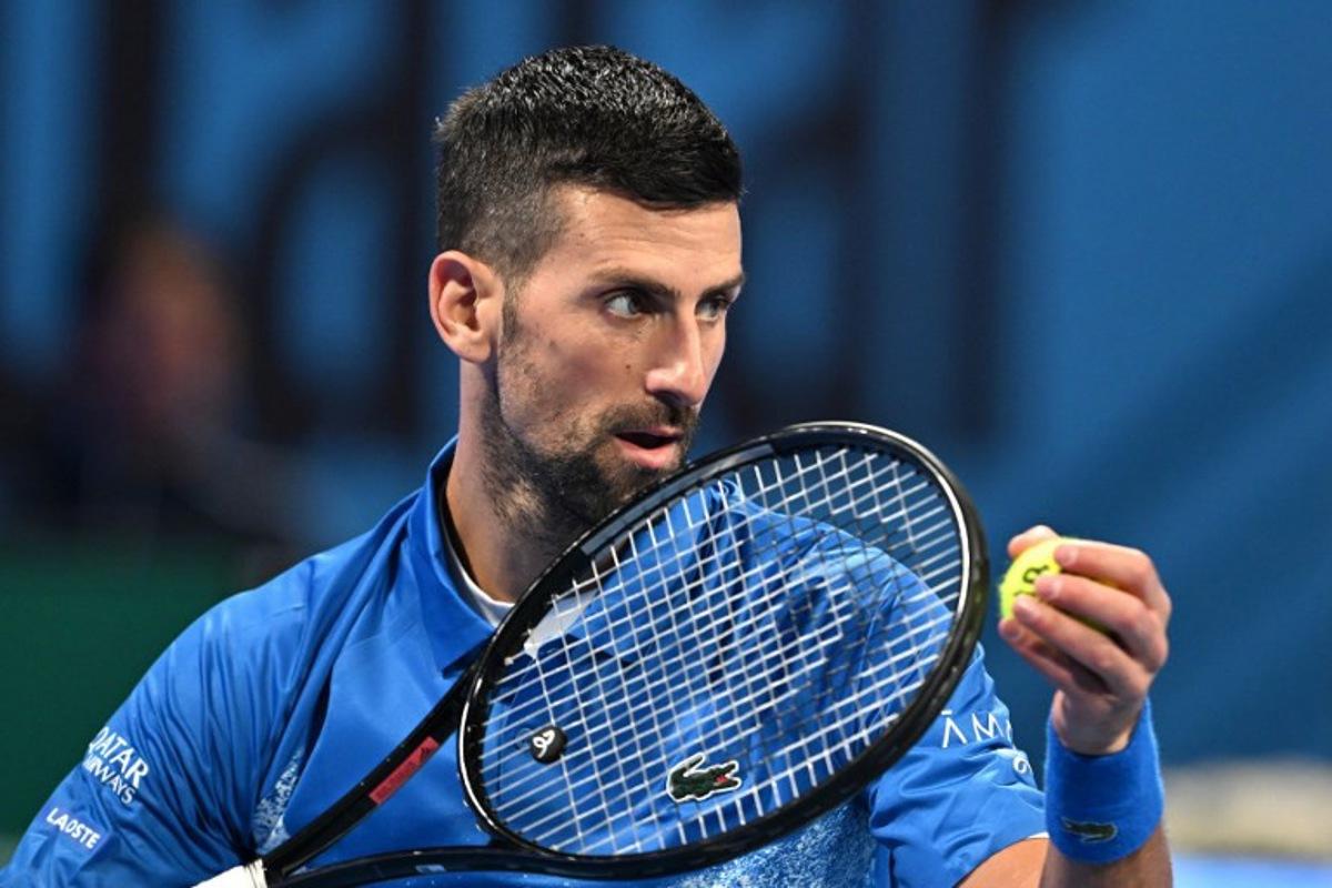 Serbia's Novak Djokovic serves against Italy's Matteo Berettini during their men's singles match at the ATP Qatar Open tennis tournament in Doha on February 18, 2025. Mahmud HAMS / AFP