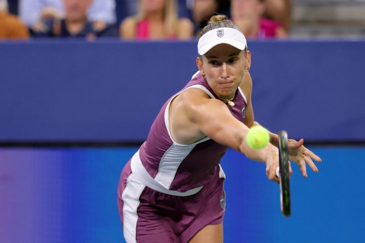 Belgium's Elise Mertens hits a return to Japan's Naomi Osaka in their women's singles third round tennis match on day seven of the US Open tennis tournament at the USTA Billie Jean King National Tennis Center in New York City on September 5, 2026. KENA BETANCUR / AFP