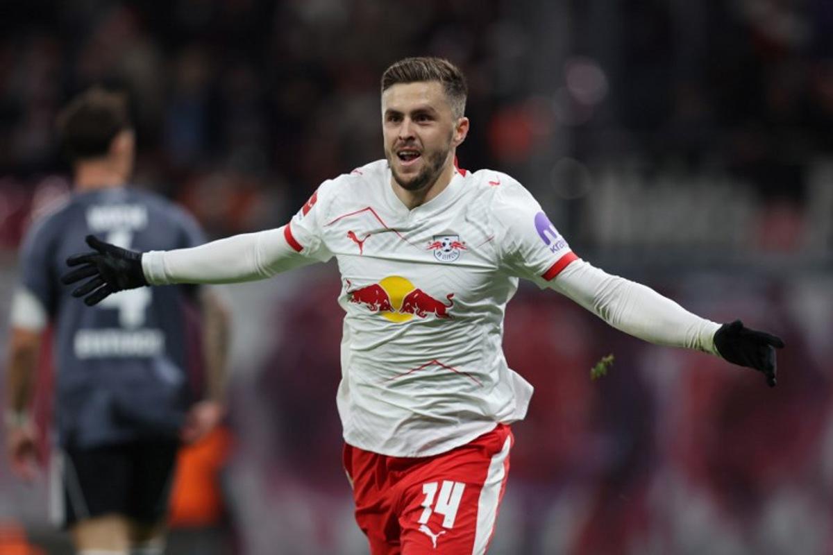 Leipzig's Austrian midfielder #14 Christoph Baumgartner celebrates scoring the 2-0 goal during the German first division Bundesliga football match between RB Leipzig and Eintracht Frankfurt in Leipzig, eastern Germany, on December 6, 2025. Ronny HARTMANN / AFP
