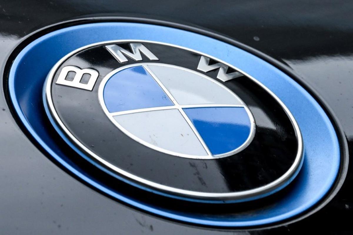A logo of German automotive brand BMW is pictured on BMW car in Frankfurt am Main, western Germany, on May 5, 2026. The BMW will announce its first-quarter financial report on May 6, 2026. Kirill KUDRYAVTSEV / AFP