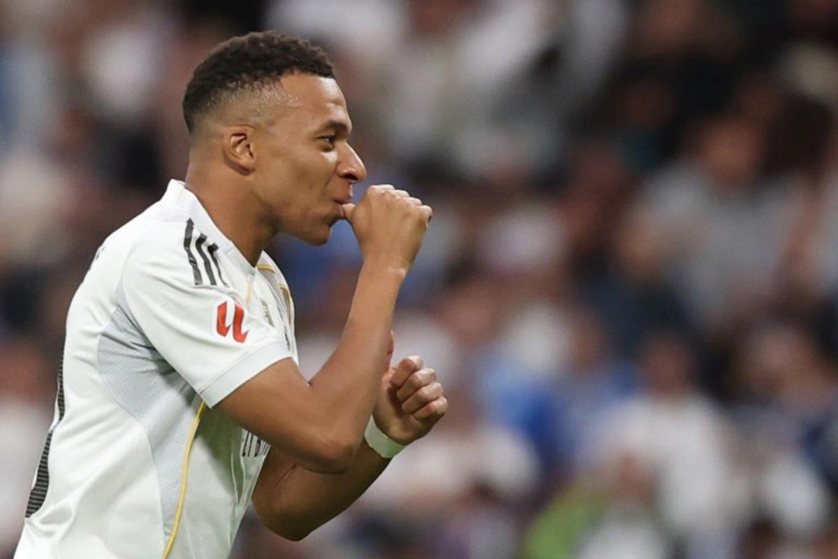 Real Madrid's French forward #10 Kylian Mbappe celebrates the opening goal, eventually disallowed, during the Spanish league football match between Real Madrid CF and FC Barcelona at Santiago Bernabeu Stadium in Madrid on October 26 , 2025. Oscar DEL POZO / AFP