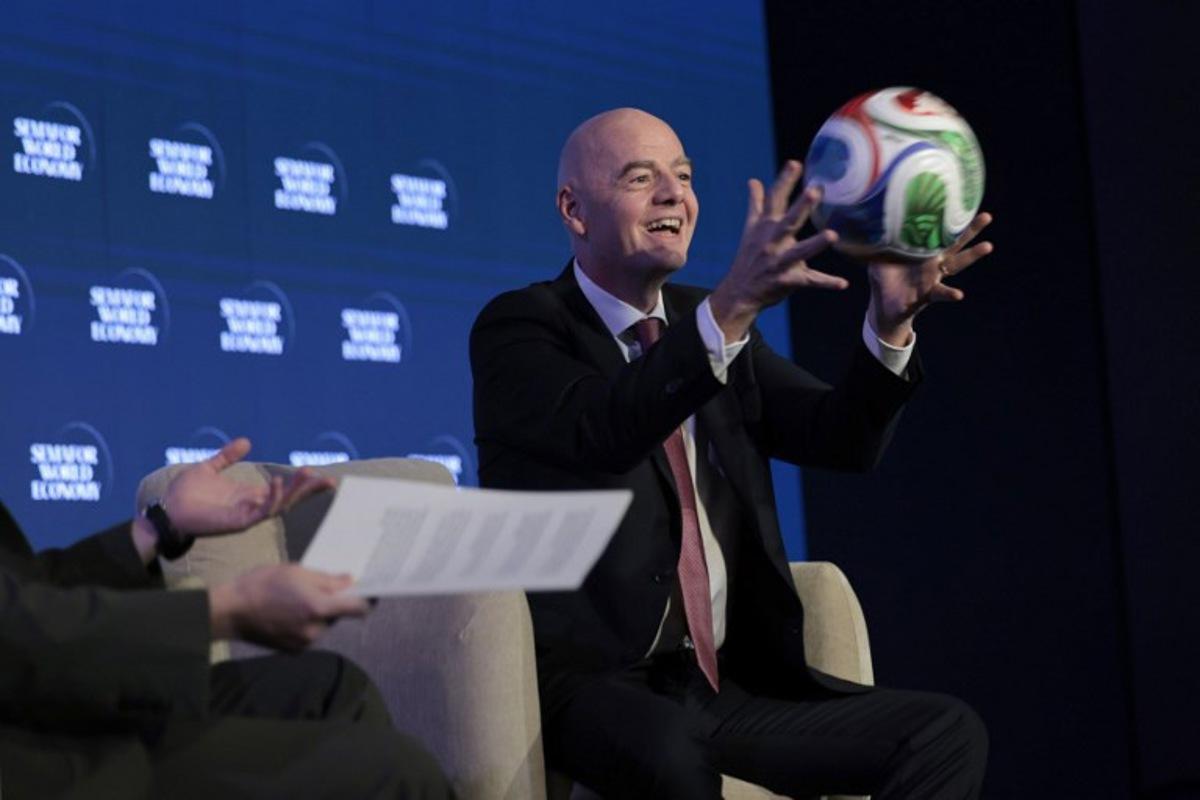 FIFA President Gianni Infantino juggles a foootball while speaking during the 2026 Semafor World Economy conference in Washington, DC, on April 15, 2026. Kent NISHIMURA / AFP