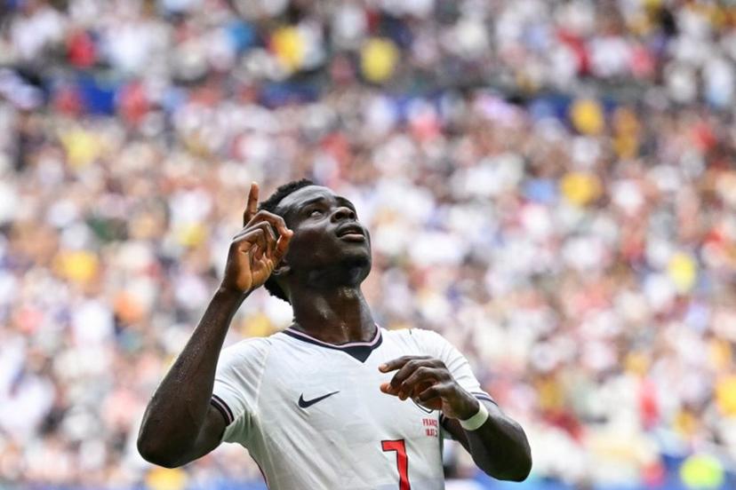 England's forward #07 Bukayo Saka celebrates scoring his team's fourth goal during the 2026 World Cup football tournament third-place match between France and England at the Miami Stadium in Miami on July 18, 2026. CHANDAN KHANNA / AFP