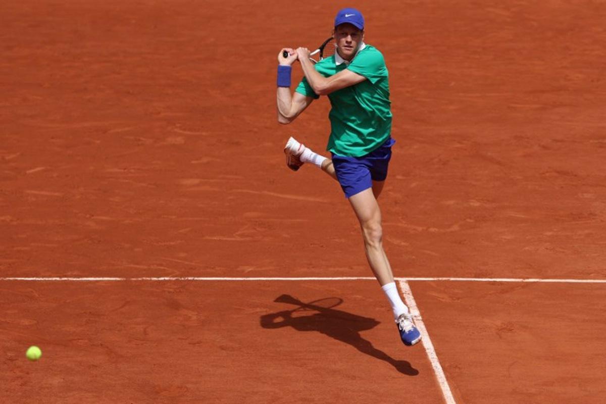 Italy's Jannik Sinner plays a backhand return to France's Richard Gasquet during their men's singles match on day 5 of the French Open tennis tournament on Court Philippe-Chatrier at the Roland-Garros Complex in Paris on May 29, 2025. ALAIN JOCARD / AFP