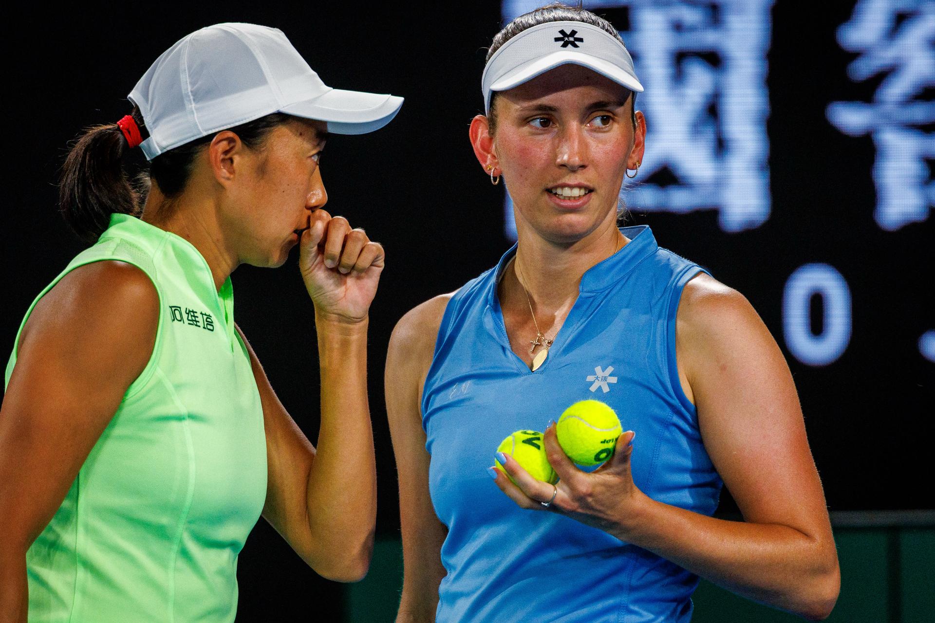 Belgium's Elise Mertens (blue) and Chinese Shuai Zhang (yellow) pictured during a tennis match between US pair Baptiste/Stearns and Belgian/ Chinese pair Mertens/Zhang, in the 1/8 final of the women doubles at the Australian Open, in Melbourne Park, Melbourne on Tuesday 27 January 2026. BELGA PHOTO PATRICK HAMILTON --- BENELUX ONLY ---