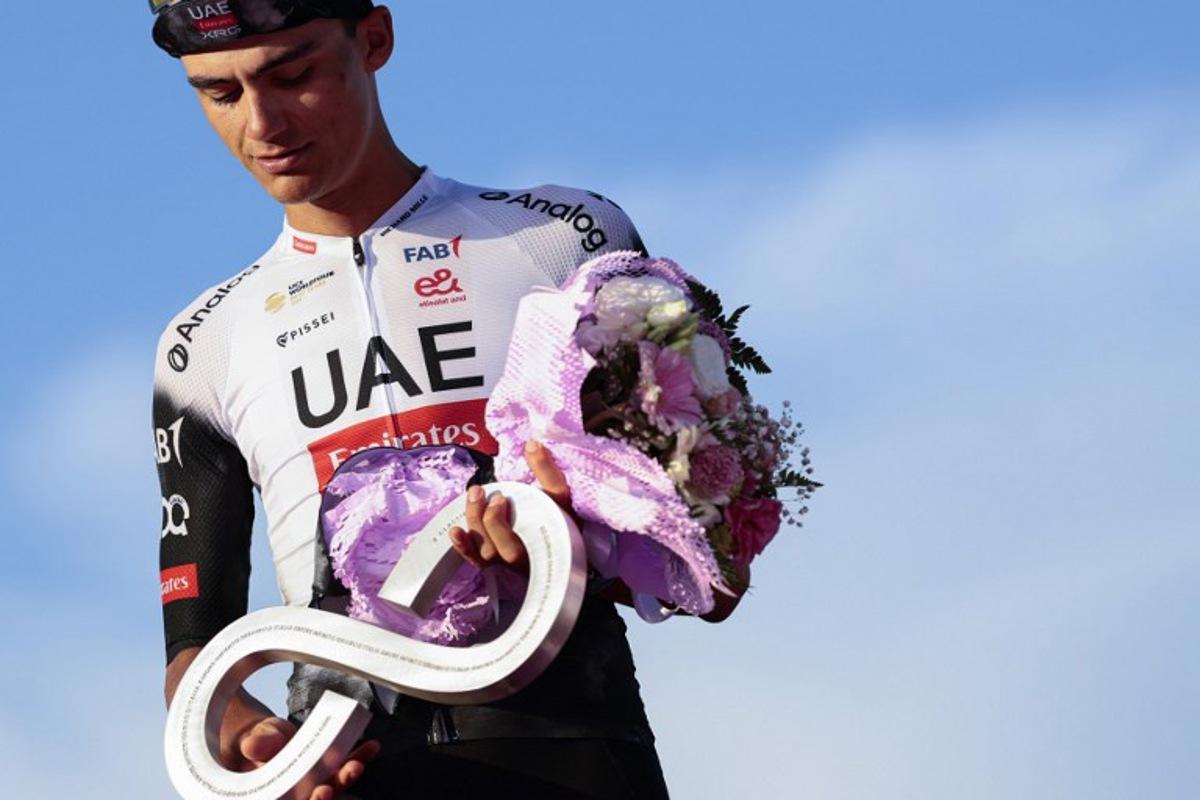 Second placed UAE Team Emirates XRG's Mexican rider Isaac Del Toro celebrates on the podium at the end of the 21st and last stage of the 108th Giro d'Italia cycling race of 143kms from Rome to Rome on June 1, 2025. Luca Bettini / AFP